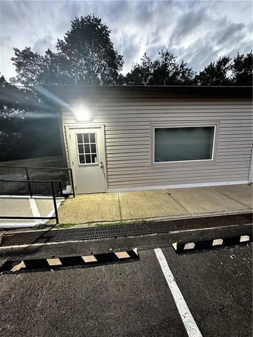 a view of a mini pool with a yard