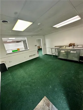 a view of a backyard with table and chairs