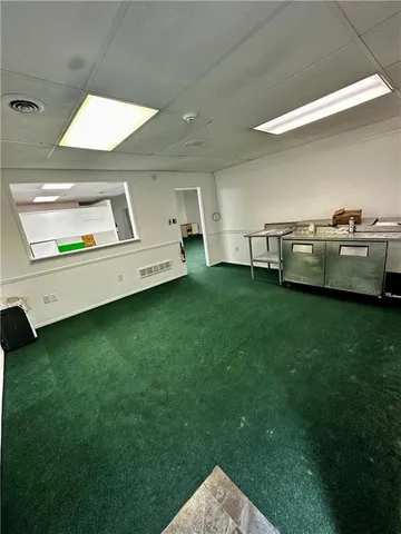 a view of a backyard with table and chairs