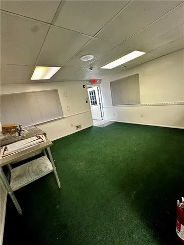 a view of a room with rack on the wall