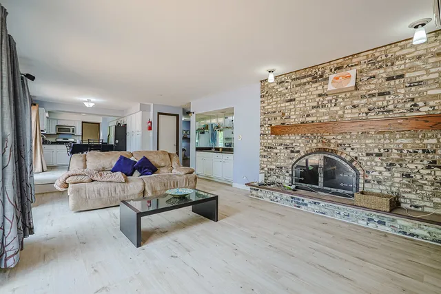 a living room with furniture and a fireplace