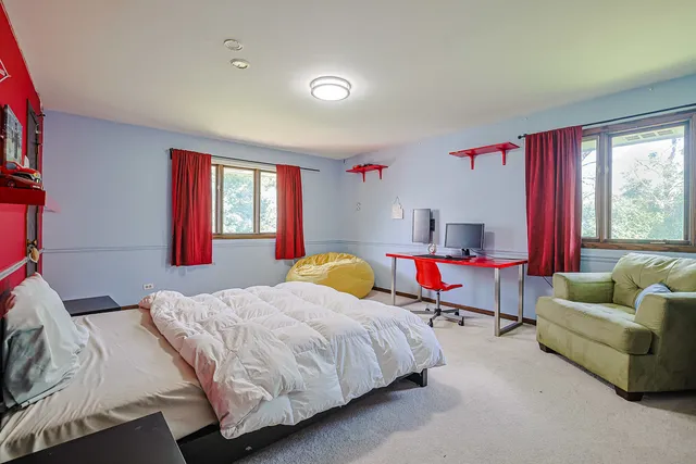 a bedroom with a bed and a couch