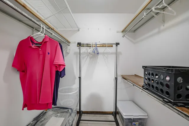 a view of a room with rack and gym equipment