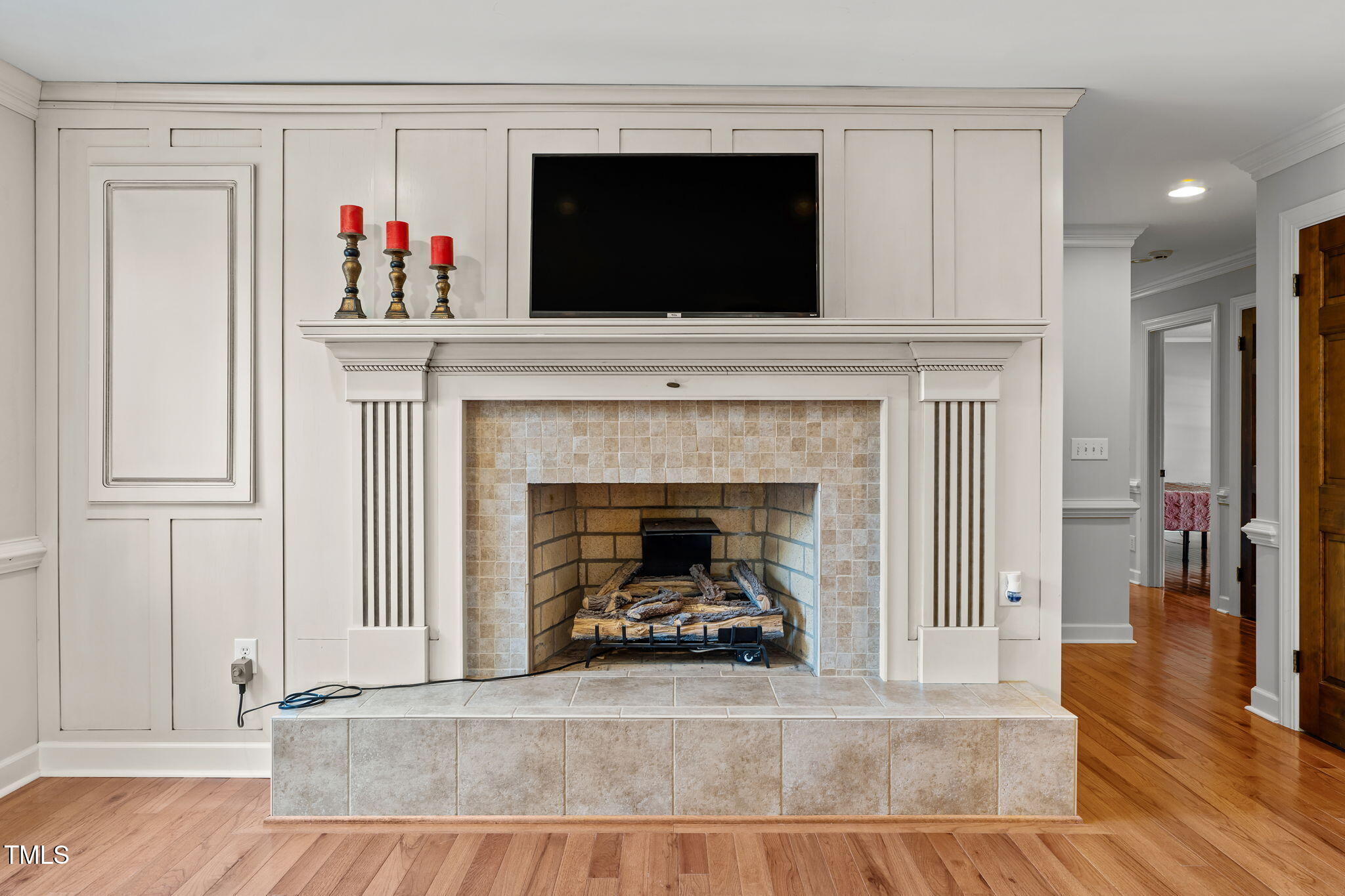 919 Drag Strip Road Benson, NC 27504 - Photo 14 of 54 a living room with a fireplace and a flat screen tv