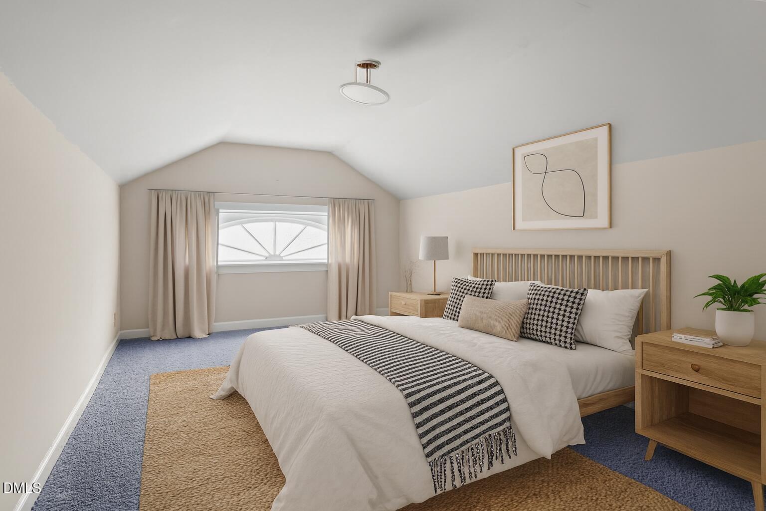 919 Drag Strip Road Benson, NC 27504 - Photo 32 of 54 a spacious bedroom with a bed and window