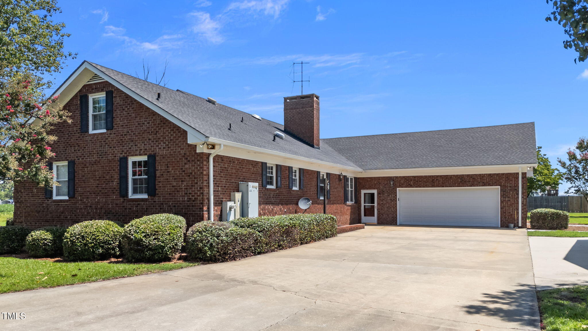 919 Drag Strip Road Benson, NC 27504 - Photo 5 of 54 a front view of a house with a yard and garage