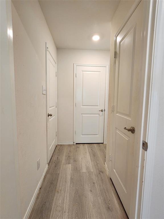 2124 Hobby Drive Forney, TX 75126 - Photo 6 of 40 Hallway viewed from laundry room (door to garage on left, hallway to entry to the right)