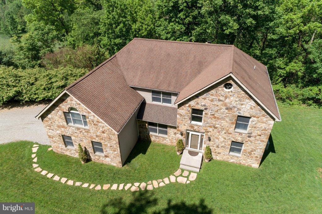 17991 Raven Rocks Road Bluemont, VA 20135 - Photo 1 of 30 a aerial view of a house next to a big yard and large trees