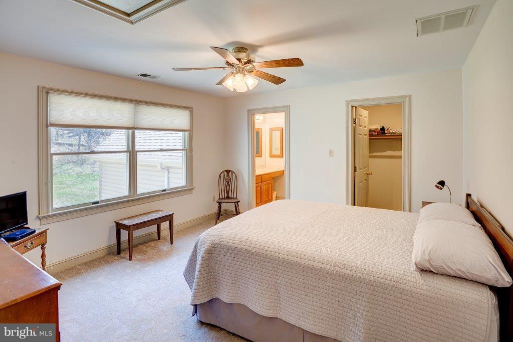 17991 Raven Rocks Road Bluemont, VA 20135 - Photo 19 of 30 a bedroom with a bed and a large window