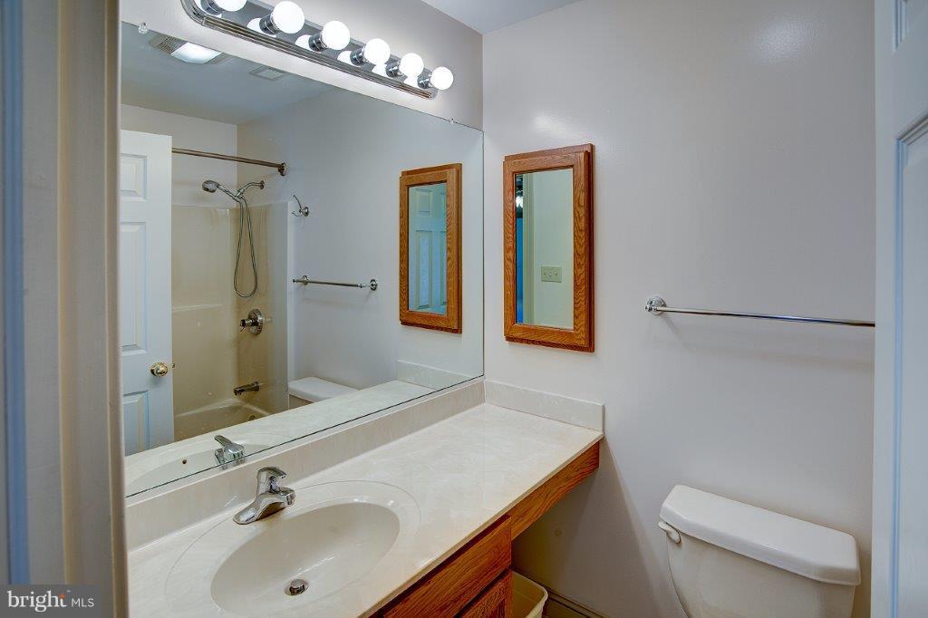 17991 Raven Rocks Road Bluemont, VA 20135 - Photo 20 of 30 a bathroom with a sink a toilet and shower