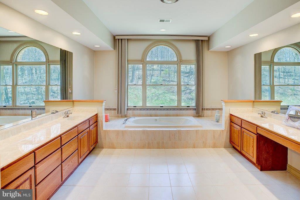 17991 Raven Rocks Road Bluemont, VA 20135 - Photo 26 of 30 a large spacious bathroom with a large window and a bath tub