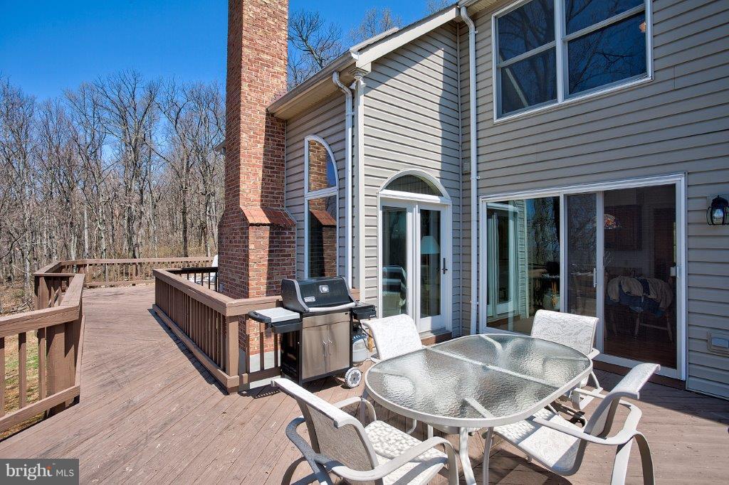 17991 Raven Rocks Road Bluemont, VA 20135 - Photo 28 of 30 a view of a patio with couches chairs and wooden floor