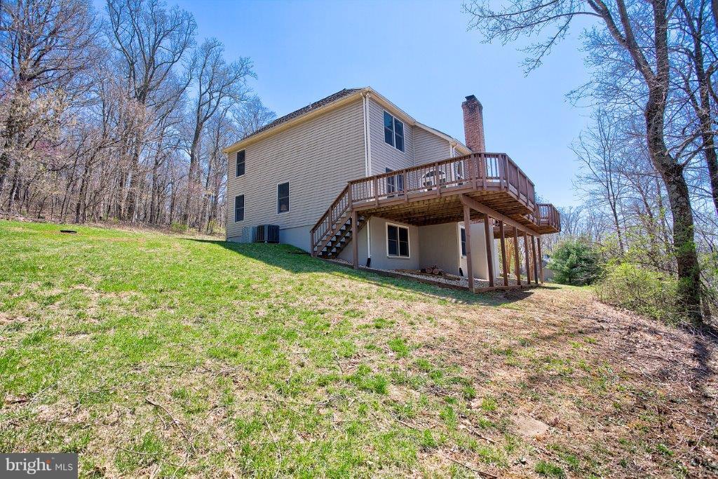 17991 Raven Rocks Road Bluemont, VA 20135 - Photo 4 of 30 a view of a house with backyard and trees