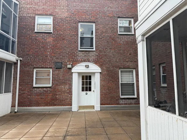 a view of a brick house with windows