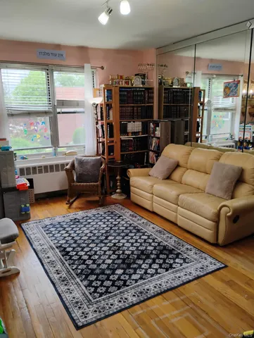 a living room with furniture rug and window