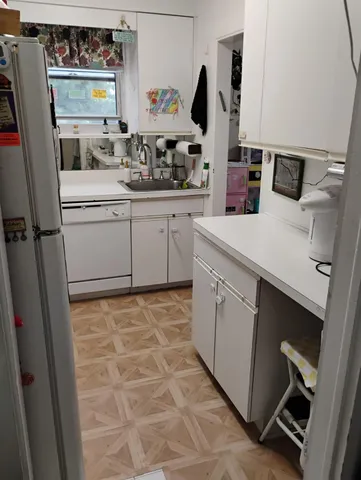 a utility room with sink dryer and washer