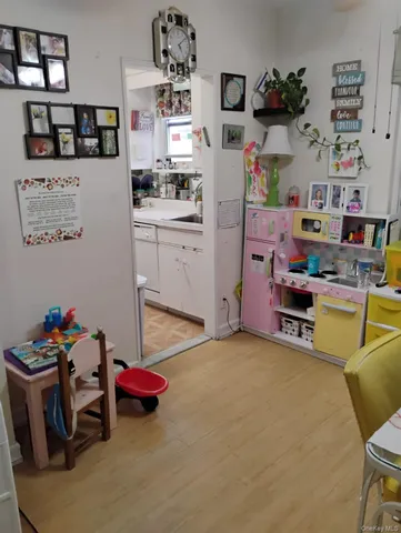 a room with furniture and a wooden floor