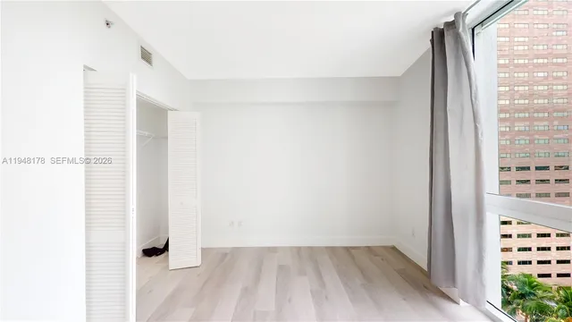a view of livingroom with hardwood floor and window