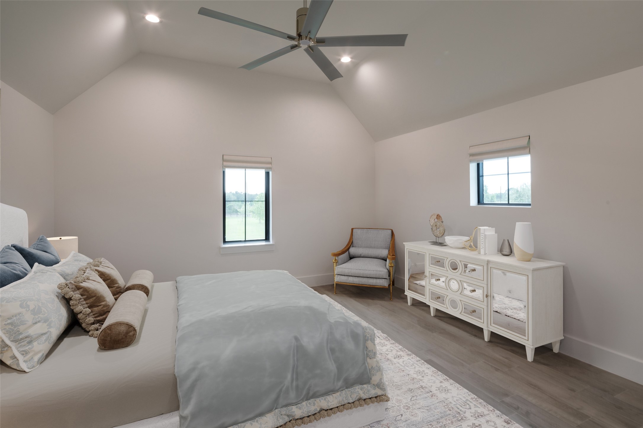 24118 Margerstadt Road Hockley, TX 77447 - Photo 25 of 46 Secondary bedrooms feature elevated ceilings, generous layouts, and oversized windows that keep the spaces feeling open throughout the day. Flexible proportions allow the rooms to function comfortably for guests, family, or additional living needs.