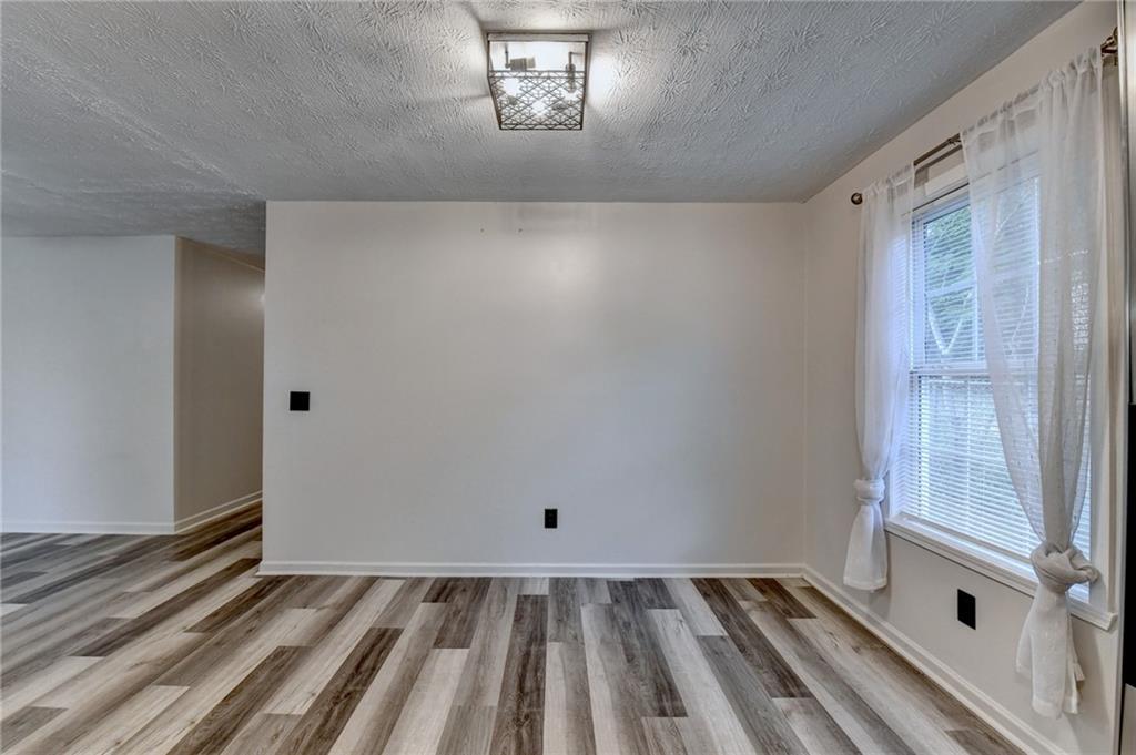 801 Davis Street Monroe, GA 30655 - Photo 15 of 33 a view of an empty room with a window