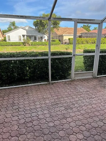 a view of a building with a yard