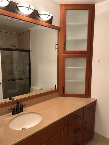 a bathroom with a sink and a mirror