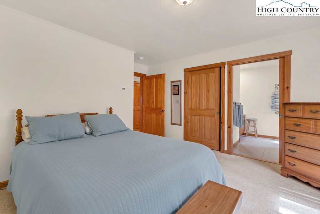 438 Virgil's Lane Boone, NC 28607 - Photo 20 of 32 a bedroom with a bed and walk in closet