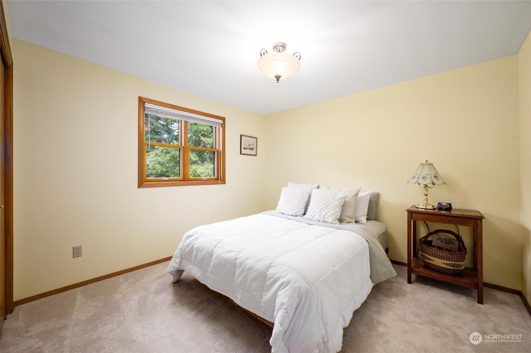 6002 Aldrich Road Bellingham, WA 98226 - Photo 12 of 30 a bedroom with a bed and a painting on the wall