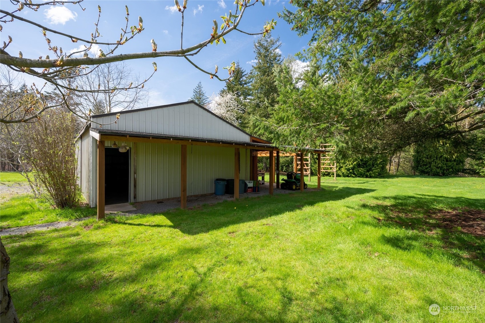 6002 Aldrich Road Bellingham, WA 98226 - Photo 18 of 30 a view of a house with backyard and a tree