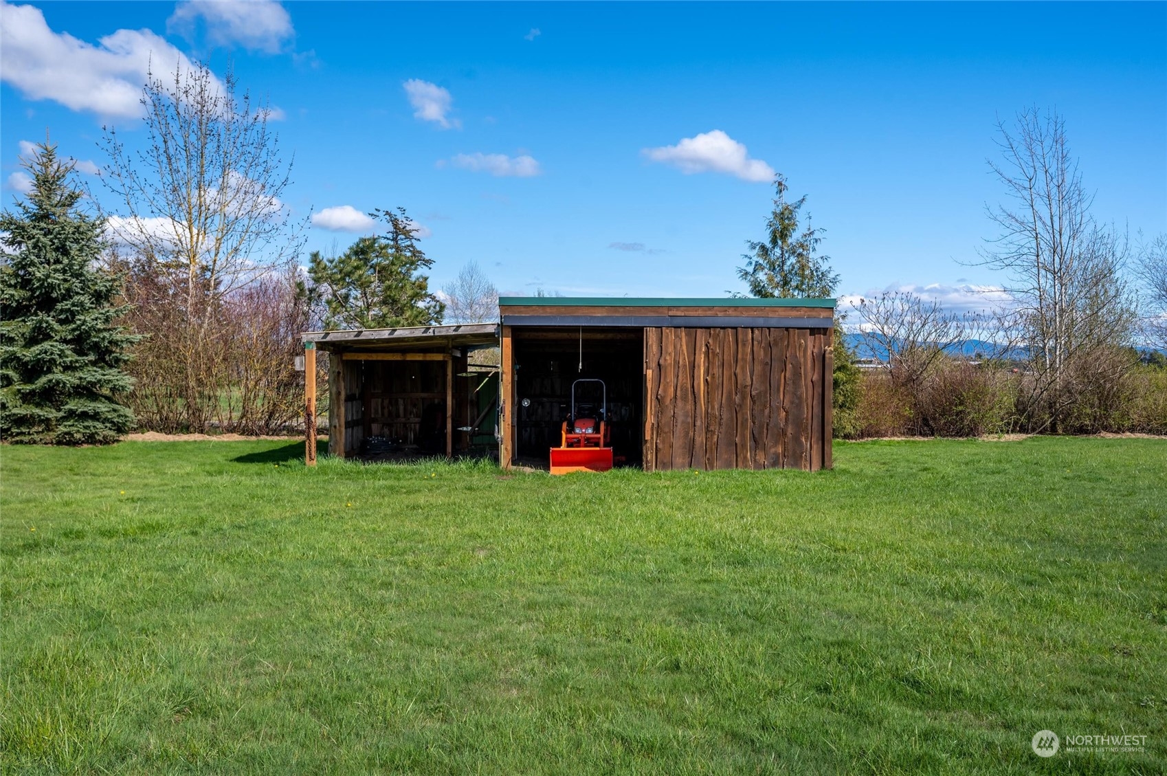 6002 Aldrich Road Bellingham, WA 98226 - Photo 22 of 30 a view of a house with backyard and garden