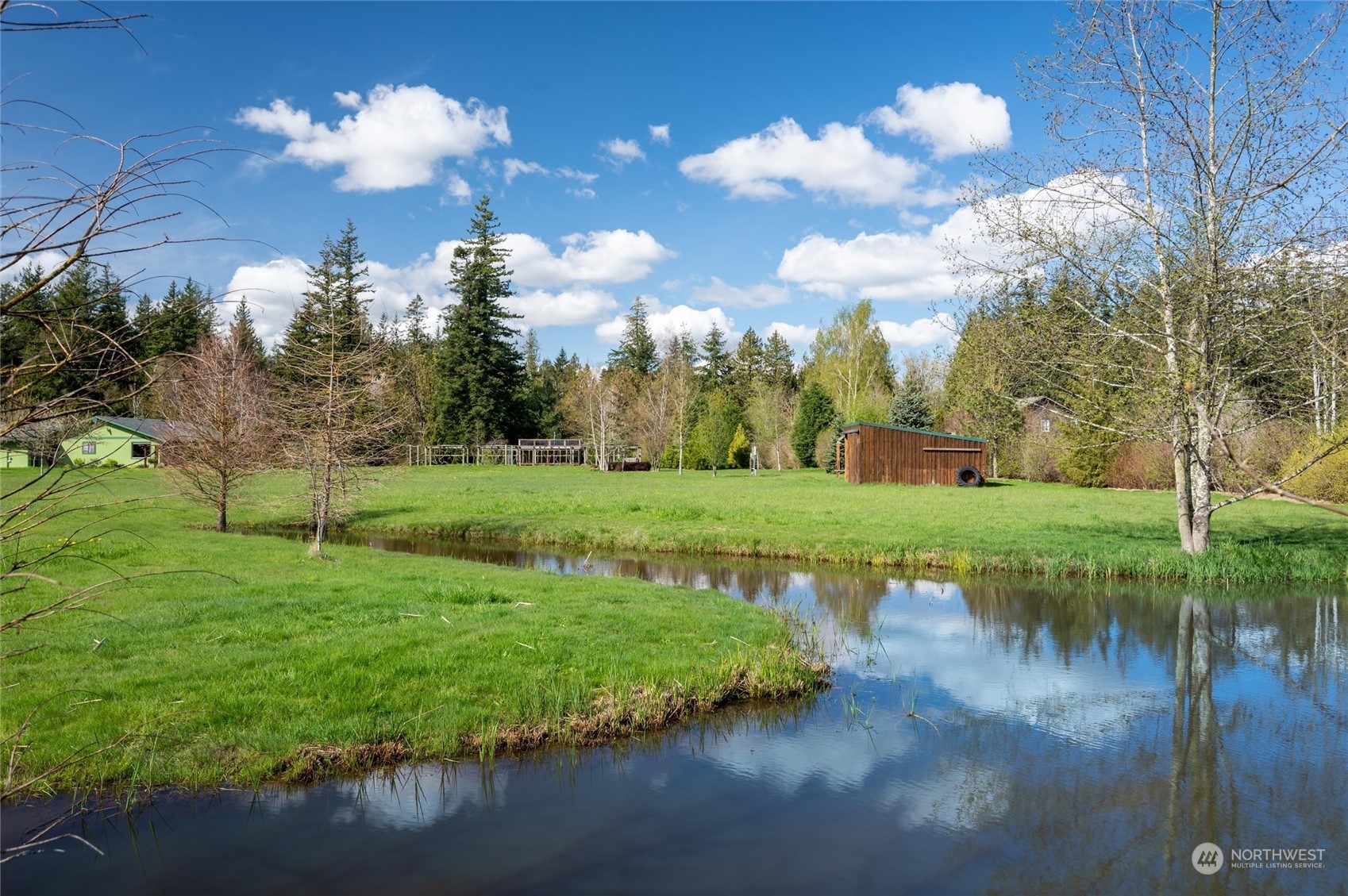 6002 Aldrich Road Bellingham, WA 98226 - Photo 25 of 30 a view of a golf course with a lake