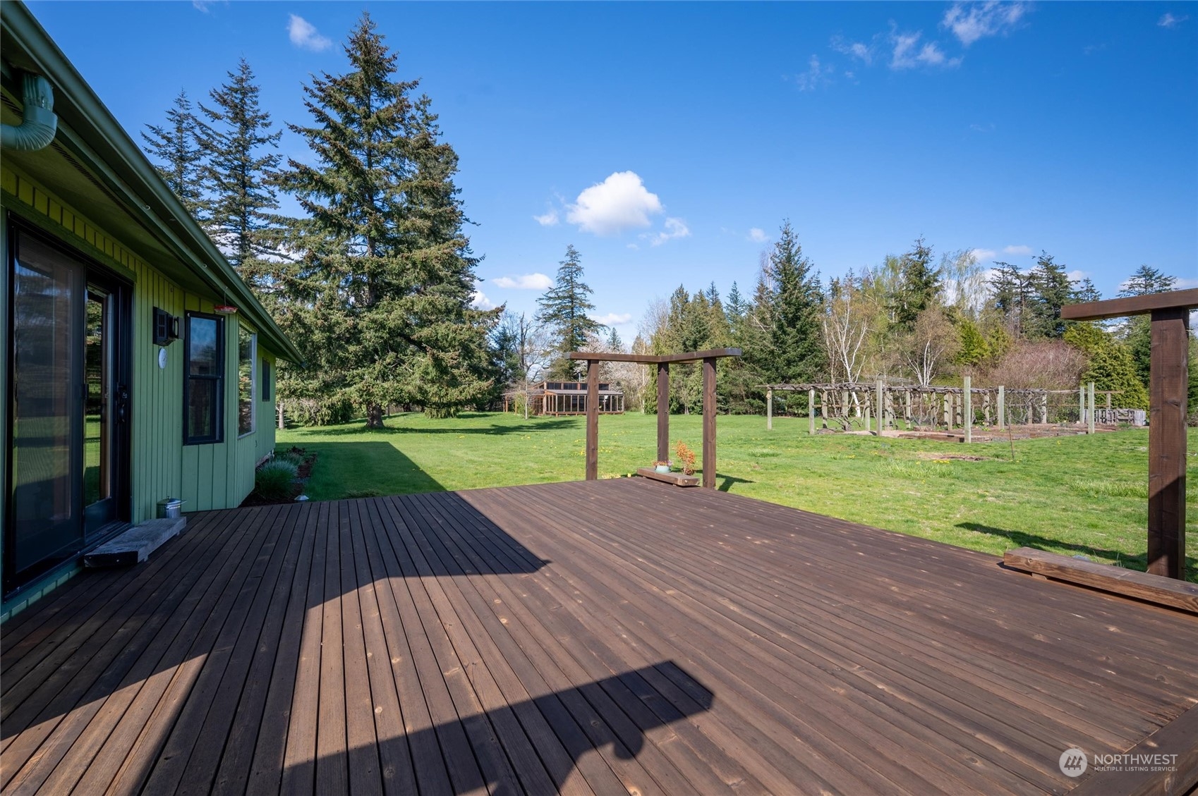 6002 Aldrich Road Bellingham, WA 98226 - Photo 28 of 30 a view of outdoor space with deck and garden