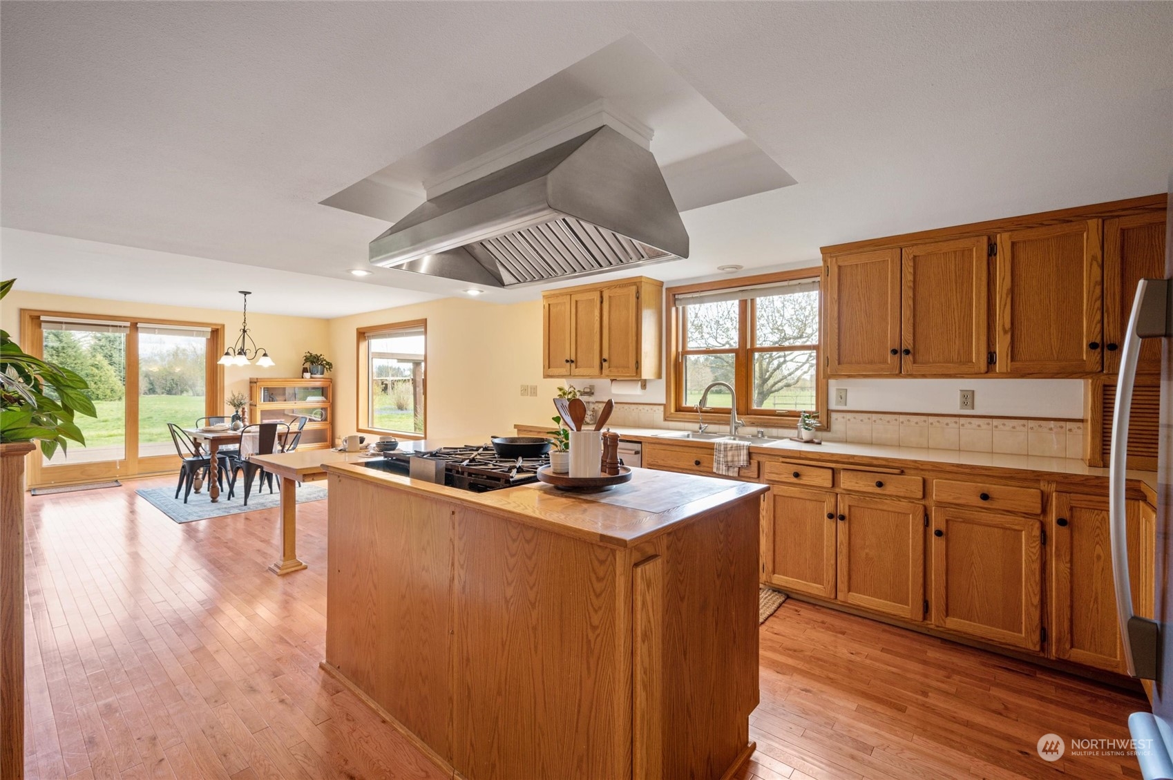 6002 Aldrich Road Bellingham, WA 98226 - Photo 9 of 30 a kitchen with sink cabinets and wooden floor