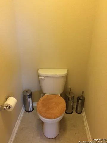 a bathroom with a toilet and a tub