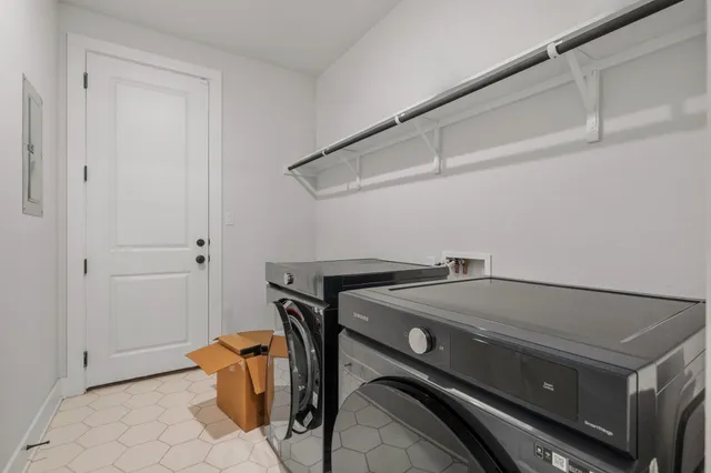 a bathroom with a sink mirror and toilet