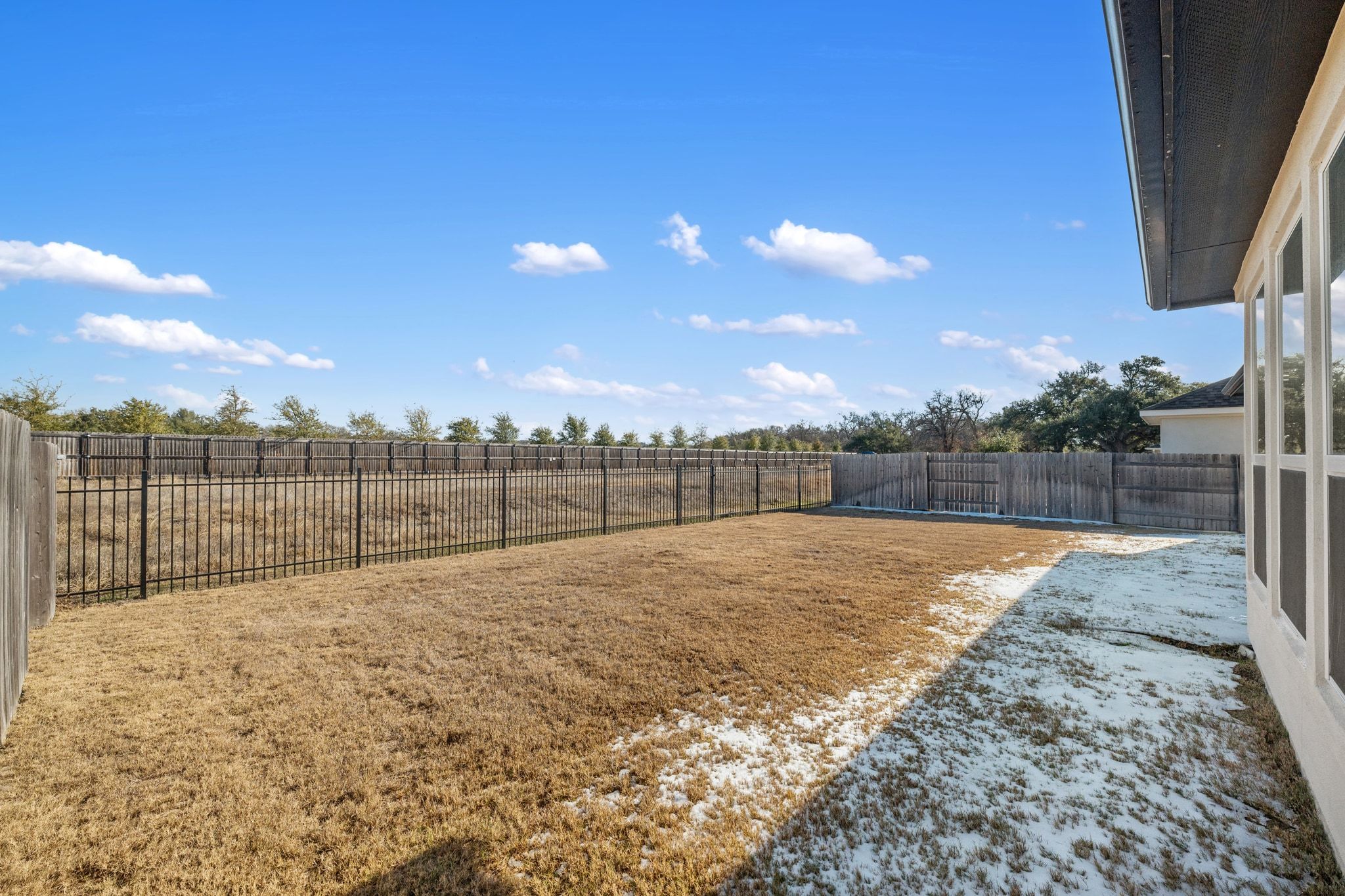 957 Arrowhead Ranch Boulevard Dripping Springs, TX 78620 - Photo 22 of 31 This home features a covered back patio and no neighbors behind! The back gate leads to the neighborhood walking trail.