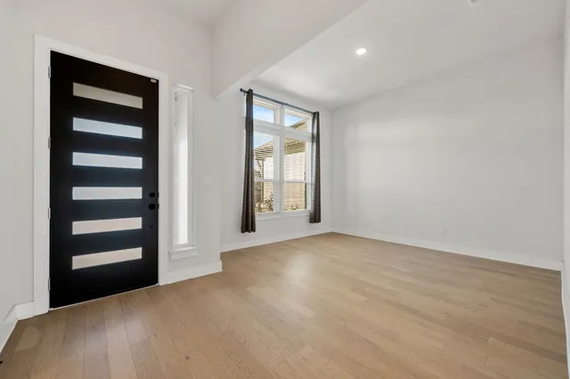 a large kitchen with stainless steel appliances granite countertop a large center island and a stove top oven