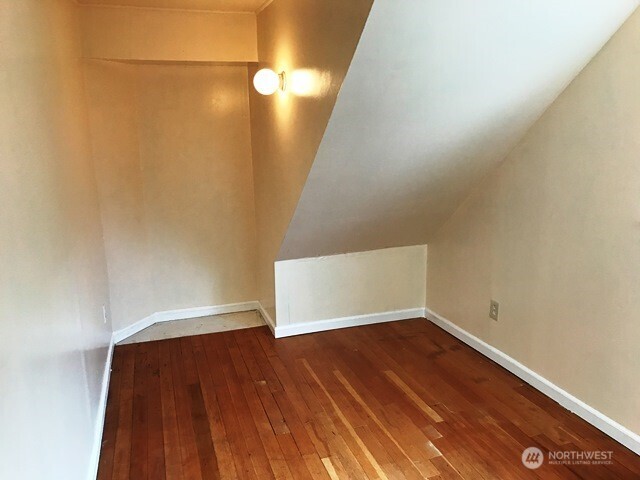 1920 East Jefferson Street, Unit B Seattle, WA 98122 - Photo 5 of 9 a view of empty room with wooden floor