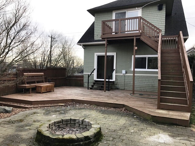 1920 East Jefferson Street, Unit B Seattle, WA 98122 - Photo 9 of 9 a view of a house with a yard chairs and wooden fence