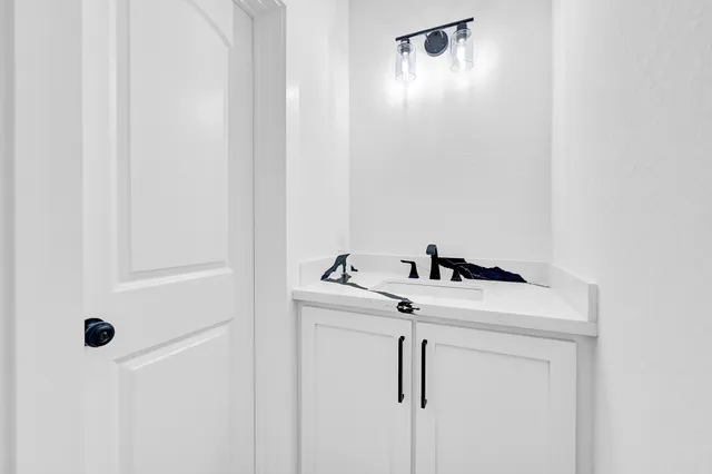a close view of a utility room with dryer and washer
