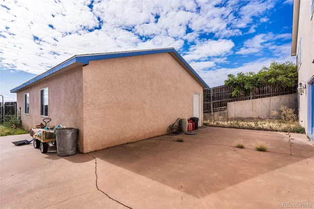 a backyard of a house with seating space