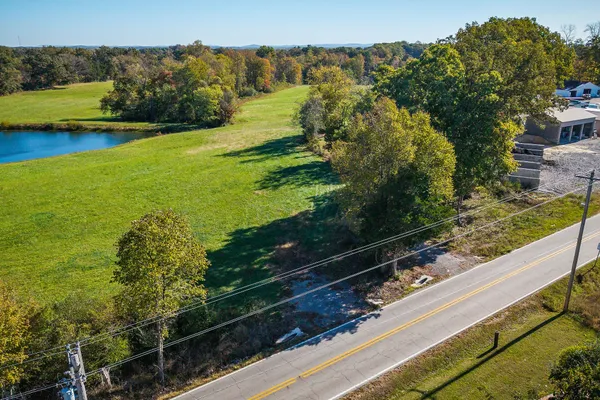 a view of a lake with a yard