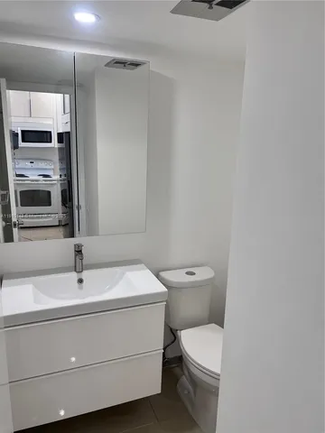 a view of bathroom with dual sinks