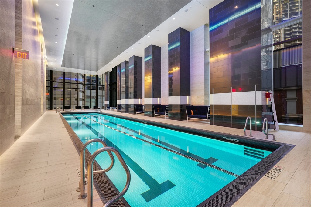 1 Franklin Street, Unit 1709 Boston, MA 02110 - Photo 12 of 17 a view of swimming pool with chairs in front of building