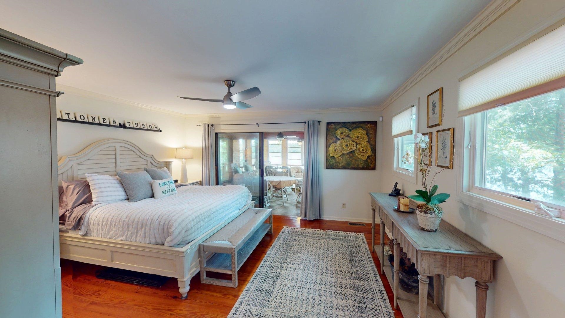 50 Cr 396 Road Iuka, MS 38852 - Photo 12 of 40 a bedroom with a bed a mirror and a large window with wooden floor