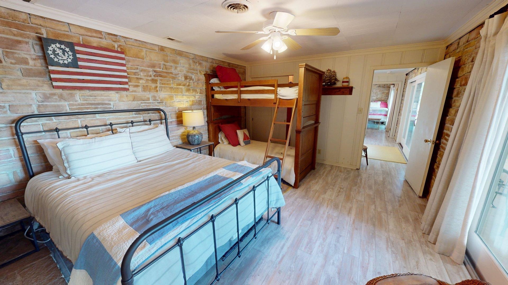50 Cr 396 Road Iuka, MS 38852 - Photo 31 of 40 a bedroom with a large bed and a flat tv screen on a dresser