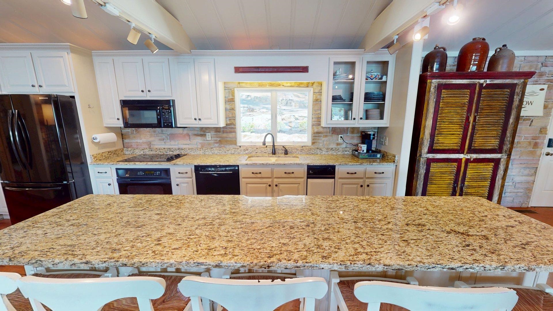 50 Cr 396 Road Iuka, MS 38852 - Photo 6 of 40 a kitchen with stainless steel appliances granite countertop a stove refrigerator and a sink