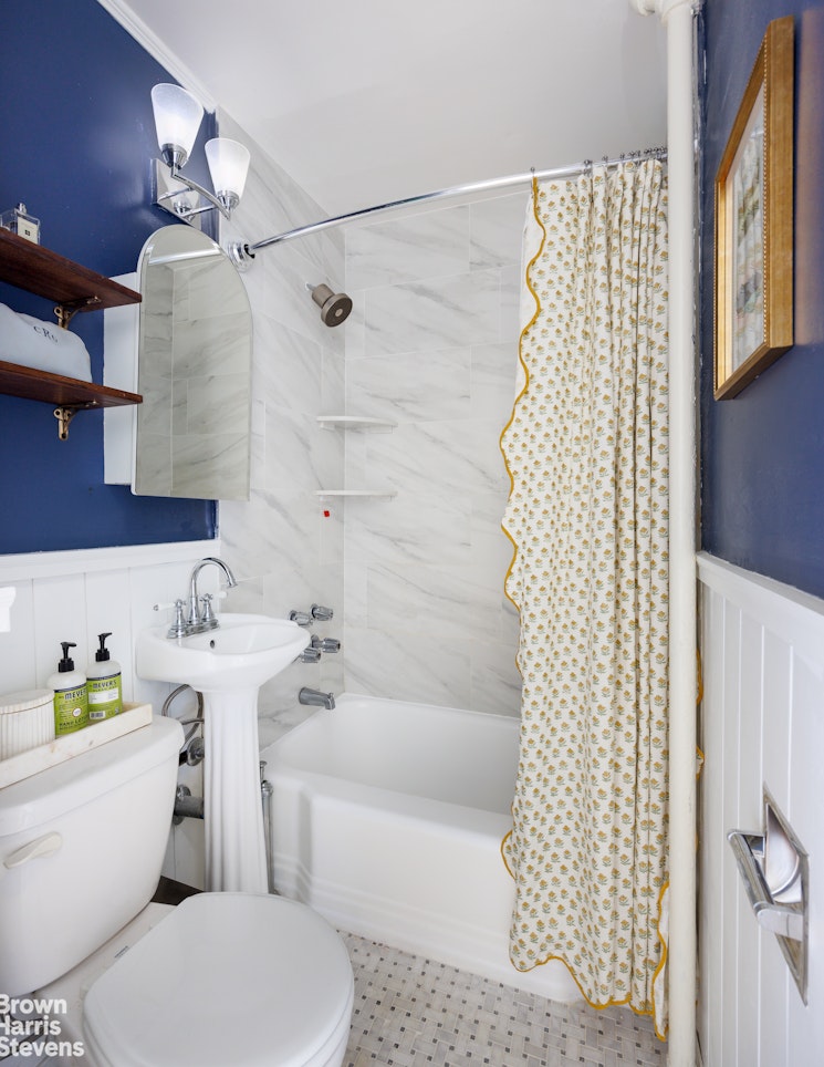 292 Riverside Drive, Unit 3A Manhattan, NY 10025 - Photo 6 of 11 a bathroom with a sink toilet and shower