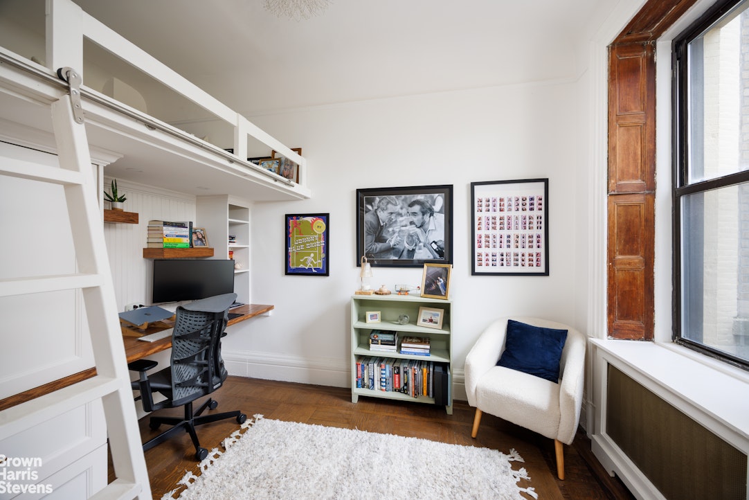 292 Riverside Drive, Unit 3A Manhattan, NY 10025 - Photo 7 of 11 a view of a livingroom with workspace and a window