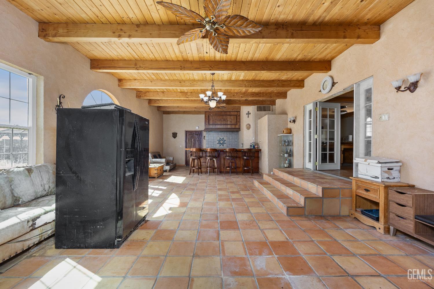 Undisclosed Address Edwards, CA 93523 - Photo 14 of 71 a view of a hallway with furniture and a chandelier